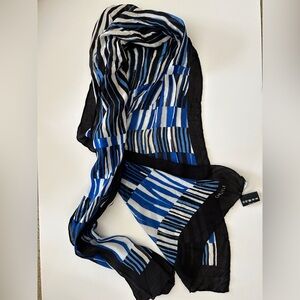 Carlisle oblong silk scarf featuring a blue, black, and white abstract striped